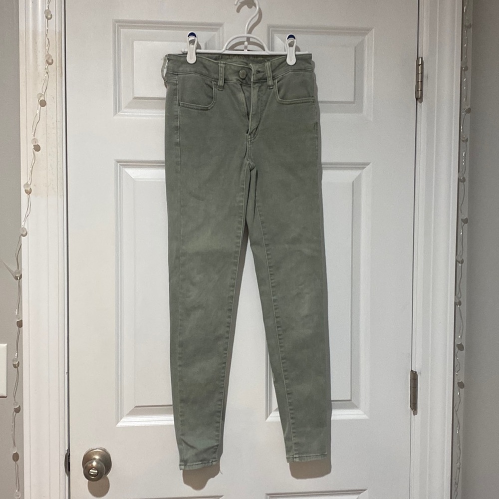 light green super stretch high rise jeggings barely worn! little bleach stain